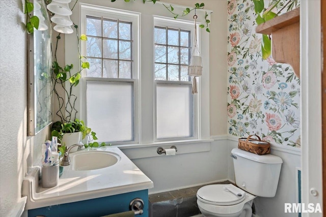 bathroom featuring vanity and toilet