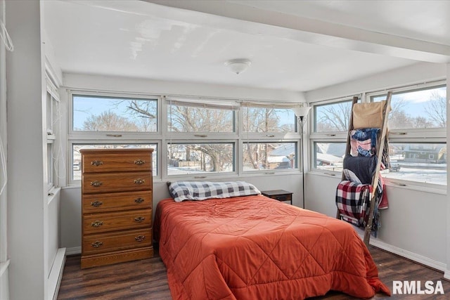 bedroom with dark hardwood / wood-style floors