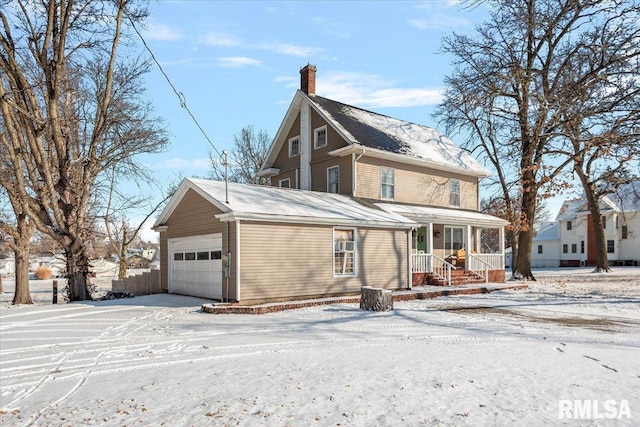 view of front of home featuring a garage and a porch