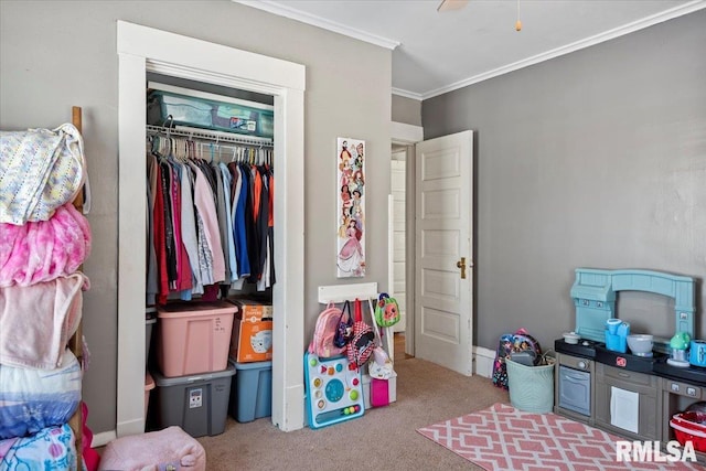 carpeted bedroom featuring ornamental molding and a closet