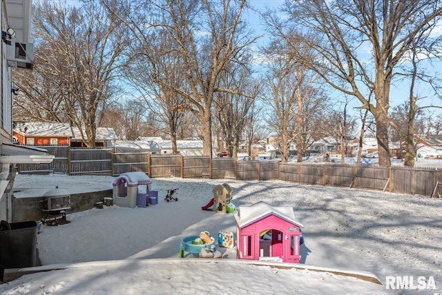 view of yard layered in snow