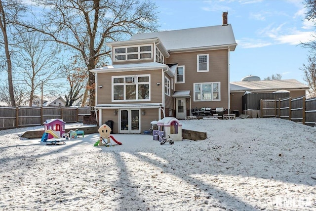 view of snow covered house