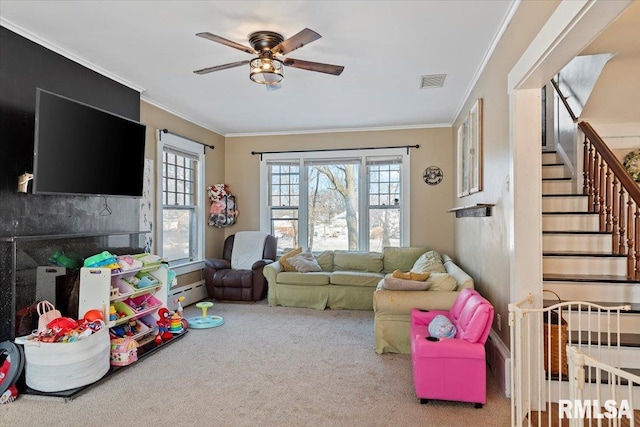 rec room featuring crown molding, ceiling fan, carpet flooring, and a wealth of natural light