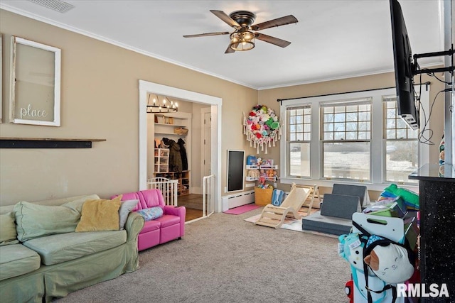 recreation room with ceiling fan, ornamental molding, carpet, and a baseboard heating unit