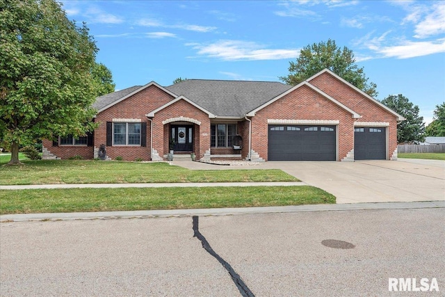 ranch-style house with a garage and a front lawn