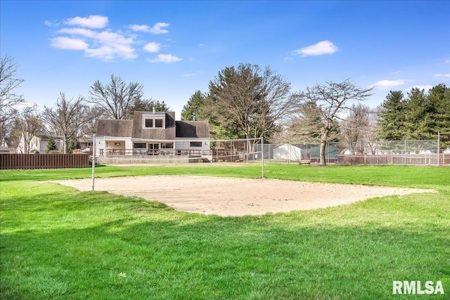 view of home's community featuring a lawn and volleyball court