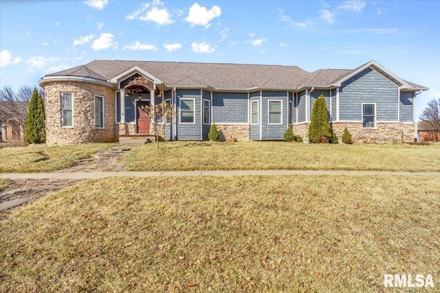 single story home featuring stone siding and a front lawn