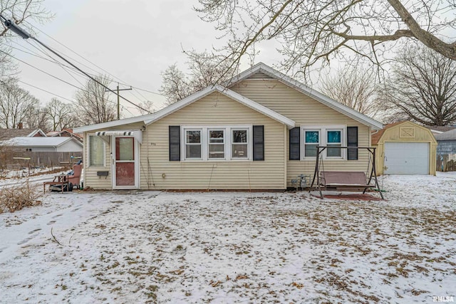 bungalow-style house with an outbuilding and a garage