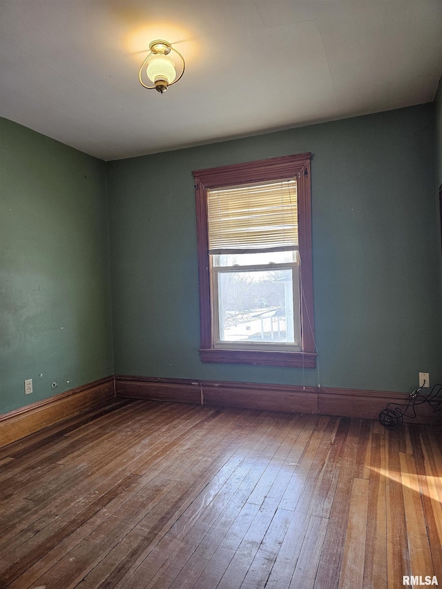 spare room featuring hardwood / wood-style floors