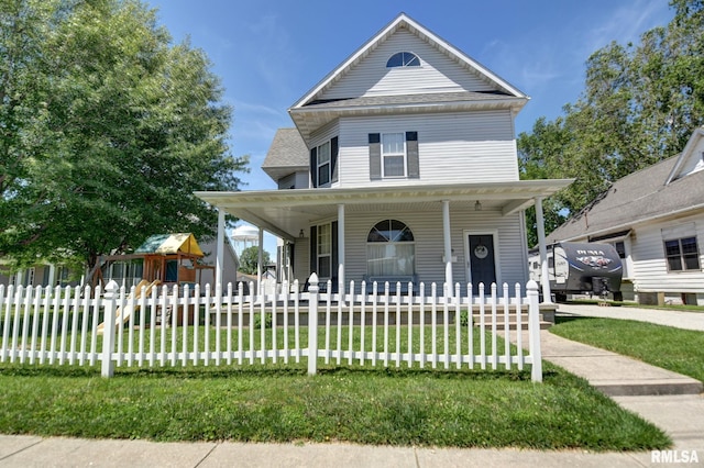 view of front facade with a porch, a front yard, and a fenced front yard