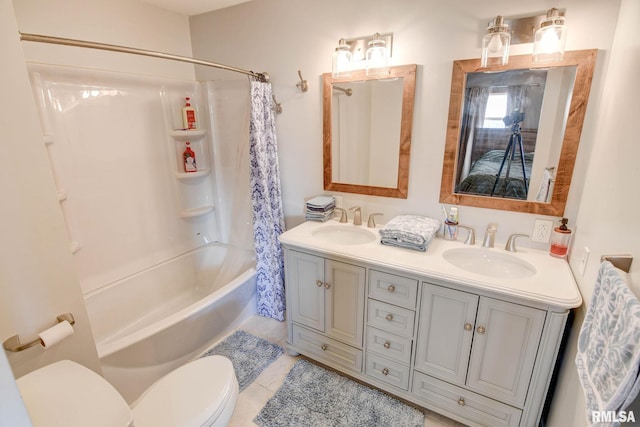 full bath featuring toilet, shower / bath combo, double vanity, and a sink