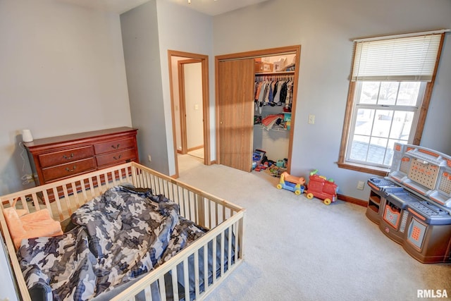 bedroom featuring a closet, carpet flooring, and baseboards