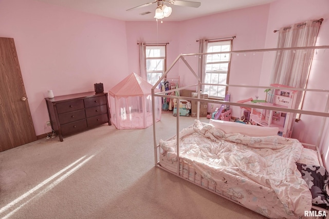 carpeted bedroom featuring a ceiling fan