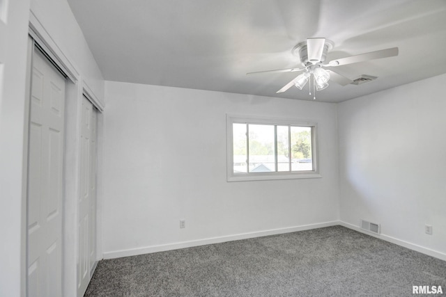 unfurnished bedroom with visible vents, carpet flooring, baseboards, and a ceiling fan