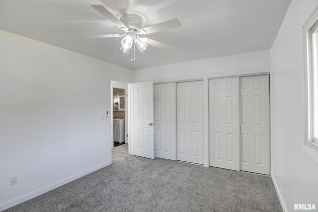 unfurnished bedroom with carpet flooring, a ceiling fan, baseboards, and two closets