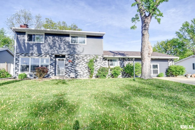 view of front facade featuring a front lawn and a chimney