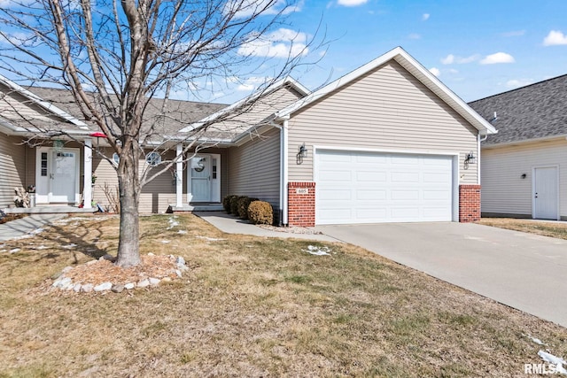 ranch-style house featuring a garage, a front lawn, concrete driveway, and brick siding