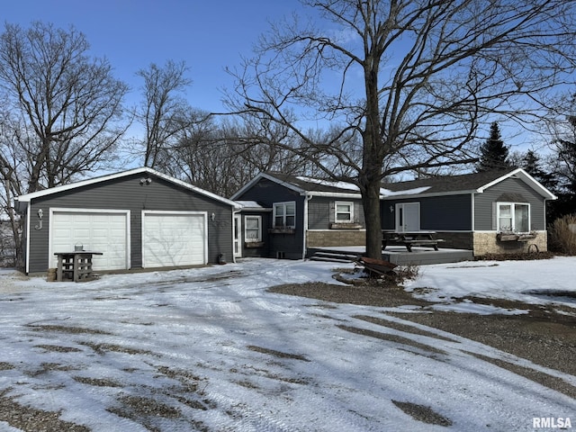 view of front of property featuring a garage and an outdoor structure