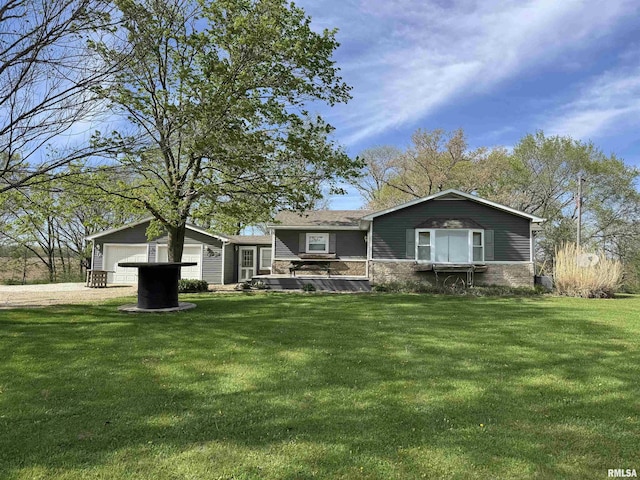 27 Knox Rd 650 N, Abingdon, IL 61410 - view of front facade with a garage, driveway, stone siding, and a front lawn