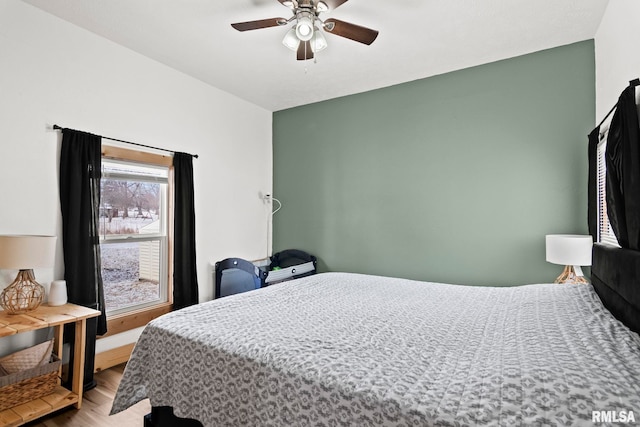 bedroom featuring ceiling fan and light wood-type flooring