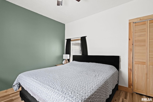 bedroom featuring hardwood / wood-style flooring and ceiling fan