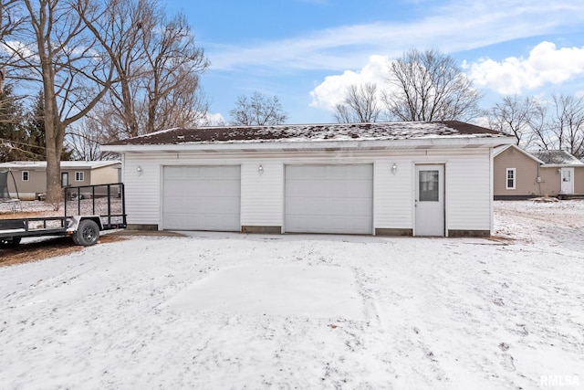 view of snow covered garage