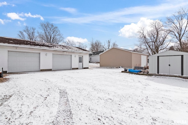 view of snow covered garage