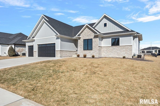 modern inspired farmhouse with concrete driveway, an attached garage, board and batten siding, a front yard, and stone siding