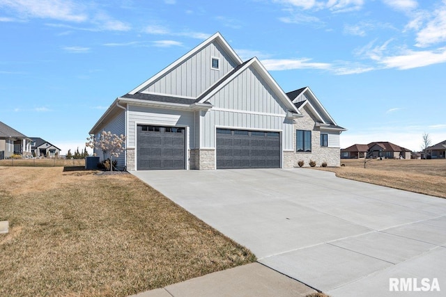 view of front of house featuring concrete driveway, board and batten siding, and a front yard