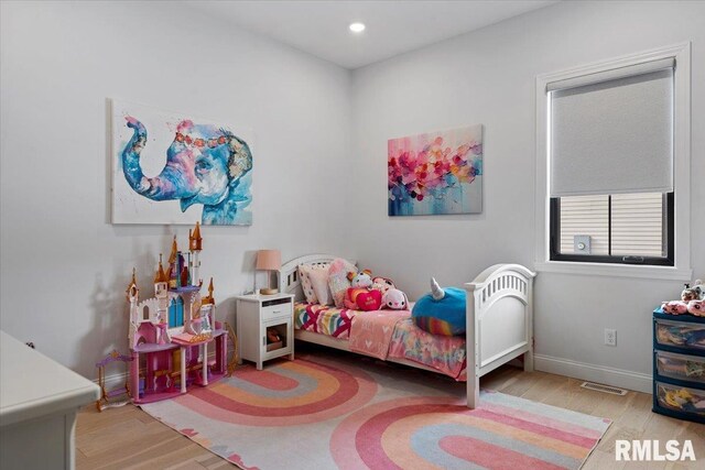 bedroom with visible vents, recessed lighting, baseboards, and wood finished floors