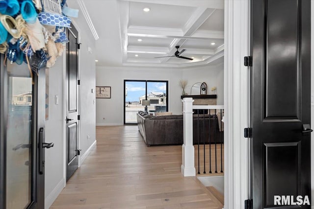 hallway featuring crown molding, beam ceiling, light wood-style flooring, baseboards, and coffered ceiling