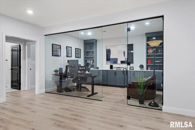 office with light wood-style floors, baseboards, and recessed lighting