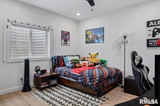 bedroom featuring baseboards, recessed lighting, ceiling fan, and wood finished floors