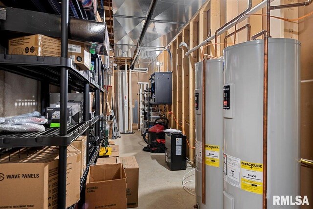 utility room featuring water heater and gas water heater