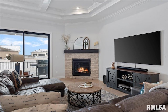 living room featuring a glass covered fireplace, recessed lighting, baseboards, wood finished floors, and ornamental molding