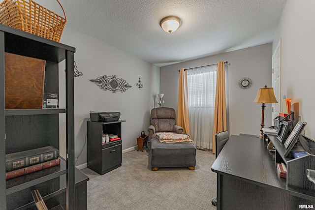 home office with carpet floors and a textured ceiling