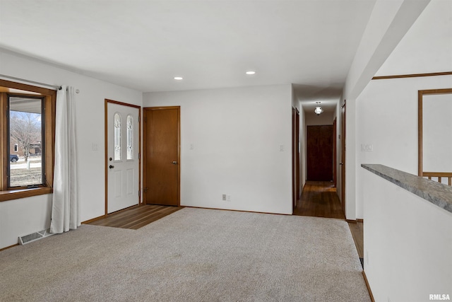 carpeted spare room with recessed lighting and visible vents