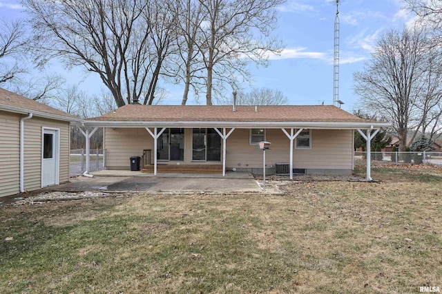 back of house featuring a patio area, a lawn, central AC, and fence