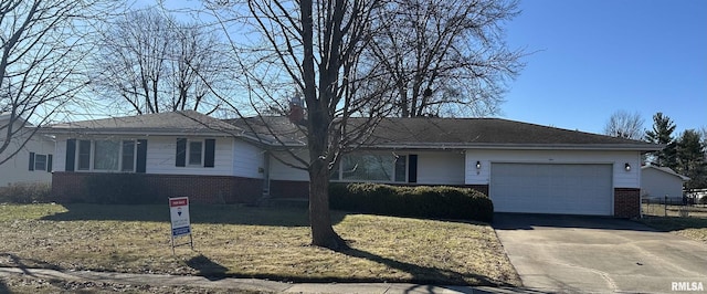 ranch-style home with a garage, driveway, and brick siding