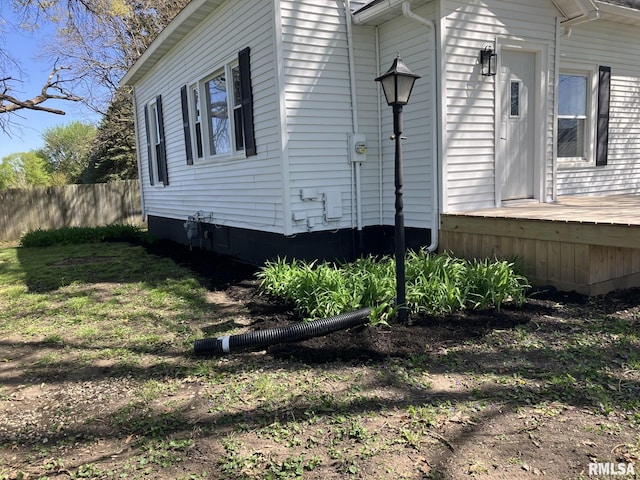 view of home's exterior featuring fence