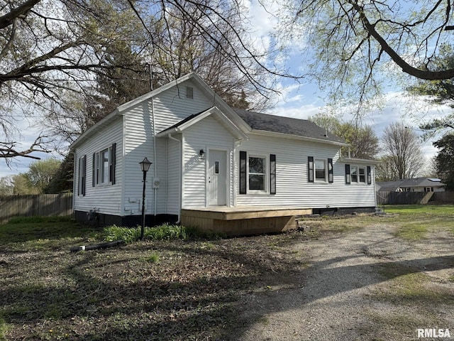 view of property exterior featuring fence