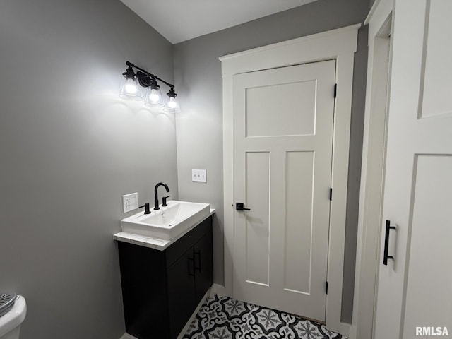 bathroom featuring tile patterned floors and vanity