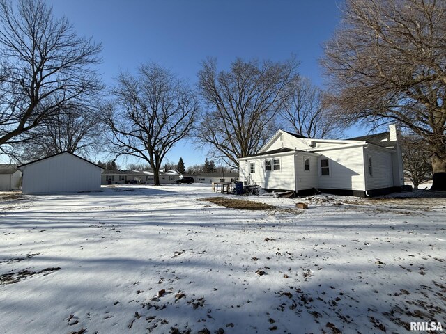 snowy yard with fence