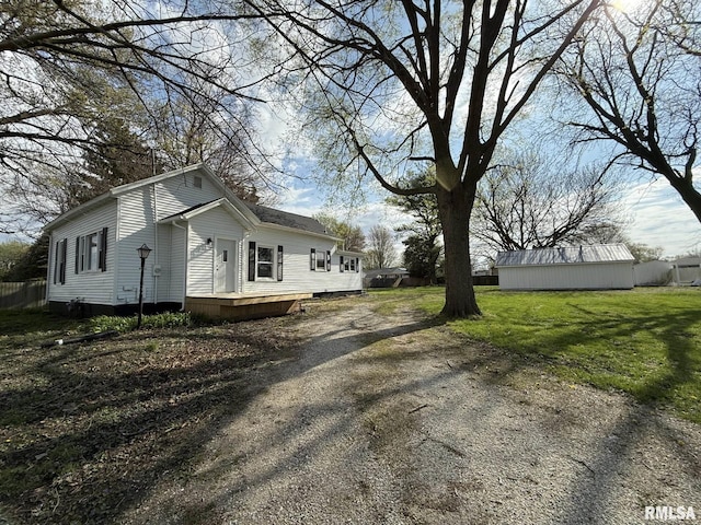 view of property exterior with fence, a deck, and a yard