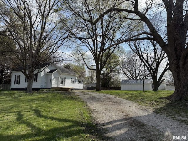 view of road with gravel driveway