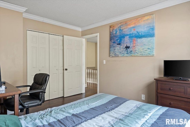 bedroom with a textured ceiling, ornamental molding, and dark wood-style flooring