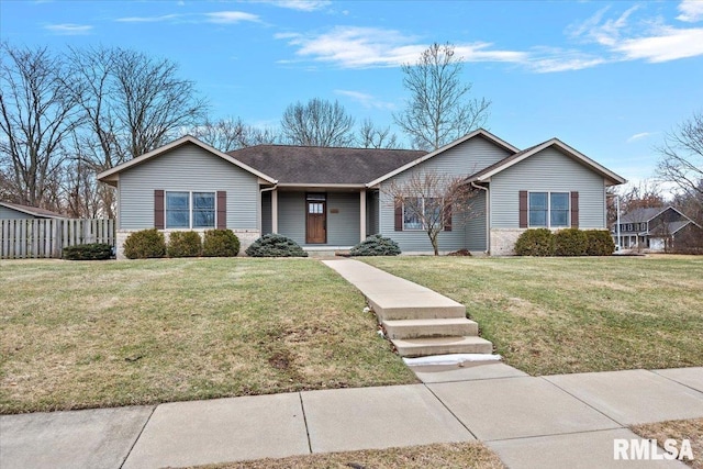 ranch-style home featuring a front yard and fence