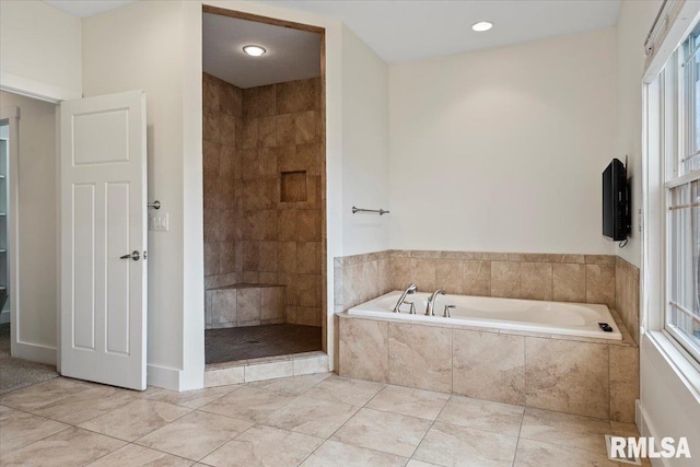 full bath with tile patterned flooring, a shower stall, and a bath