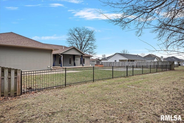 view of yard featuring a residential view and a fenced backyard