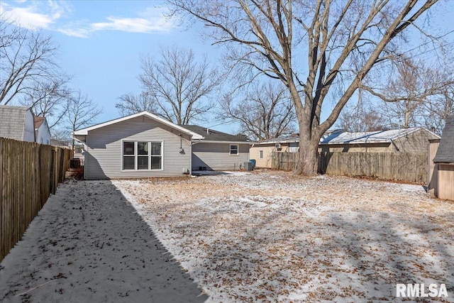 back of house featuring a fenced backyard